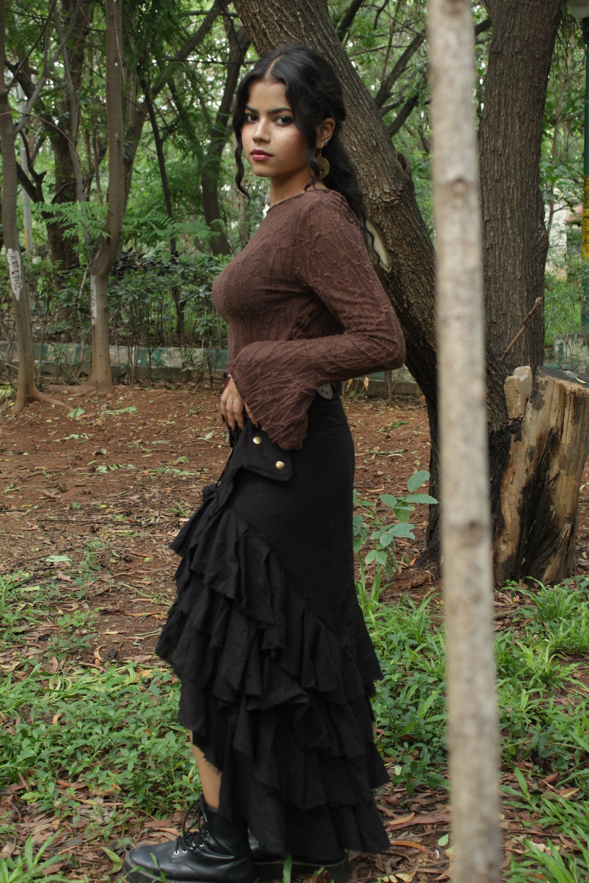 Boho girl wearing black skirt in a park