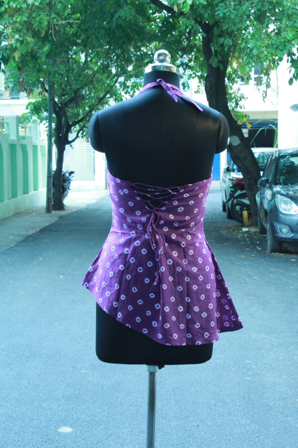 Julliet Rani- asymmetric purple halteneck Bandhani short corset kurti top